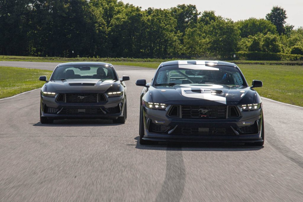 Ford Mustang Dark Horse R driving next to road car