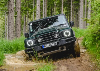 Hydrogen fuel cell Ineos Grenadier driving through mud puddle