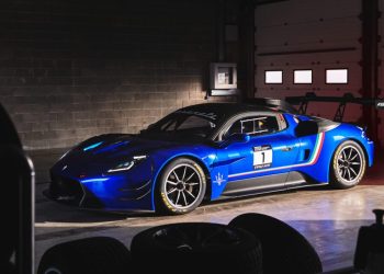 Maserati GT2 parked in pit garage at race track