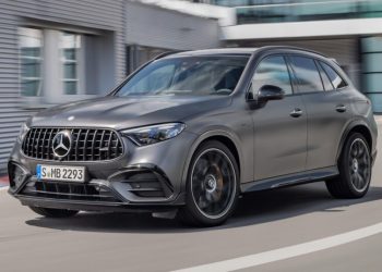Mercedes-AMG GLC 63 S E Performance driving past factory
