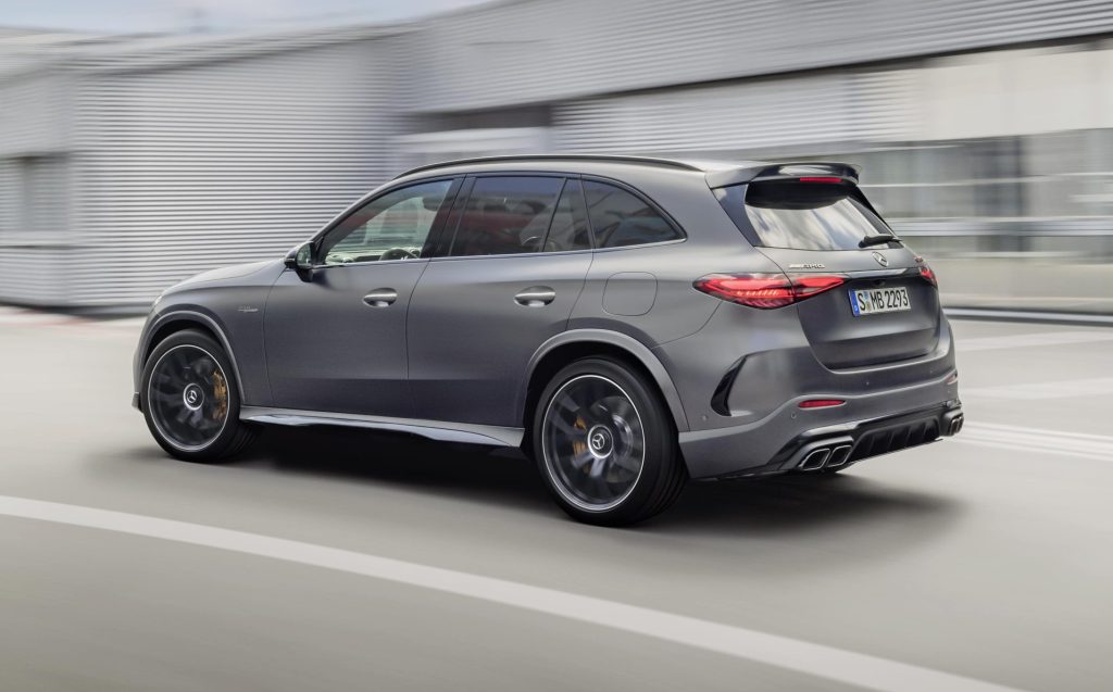 Mercedes-AMG GLC 63 S E Performance driving past factory