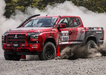 Mitsubishi Triton rally car drifting on gravel