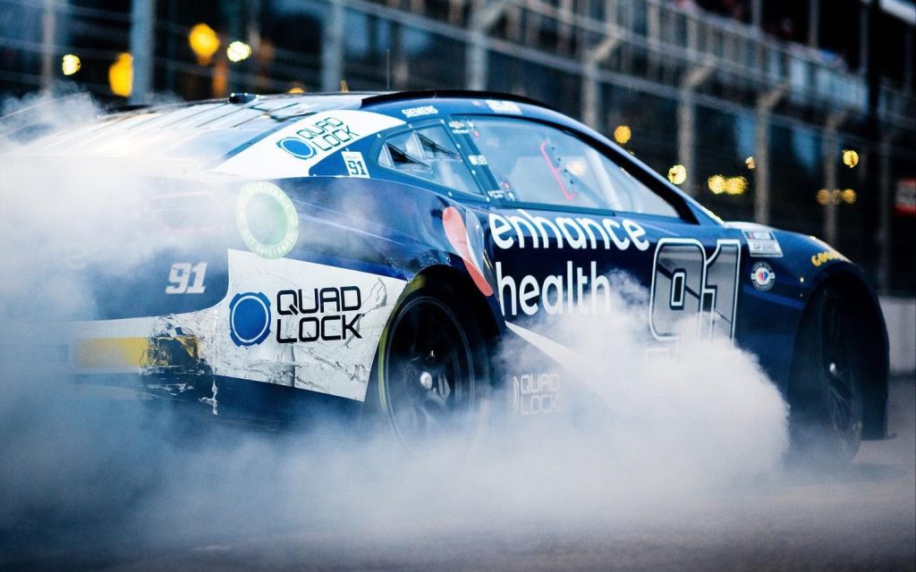 Shane van Gisbergen doing burnout in NASCAR at Chicago street race