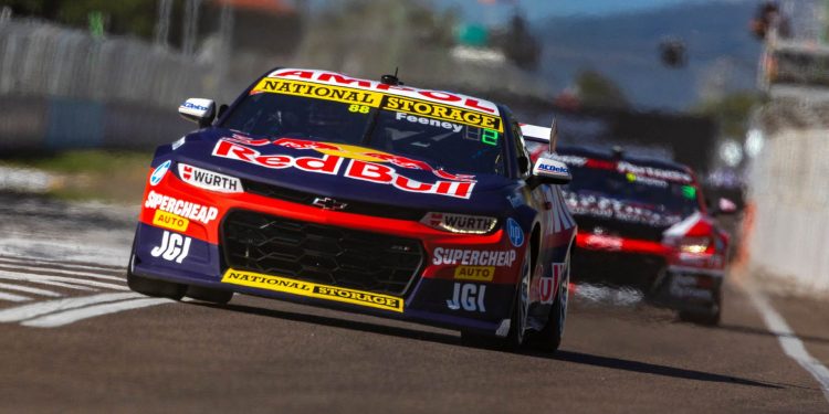 Shane van Gisbergen driving Supercar up pit lane in Townsville