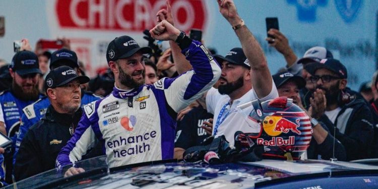 Shane van Gisbergen celebrating NASCAR win in Chicago