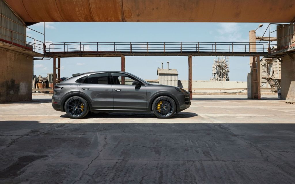 Porsche Cayenne Turbo E-Hybrid Coupe parked by old pipe