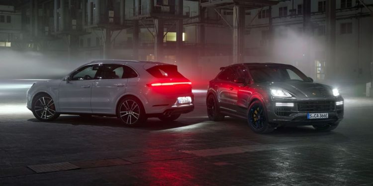 Porsche Cayenne Turbo E-Hybrid SUV and Coupe parked next to each other