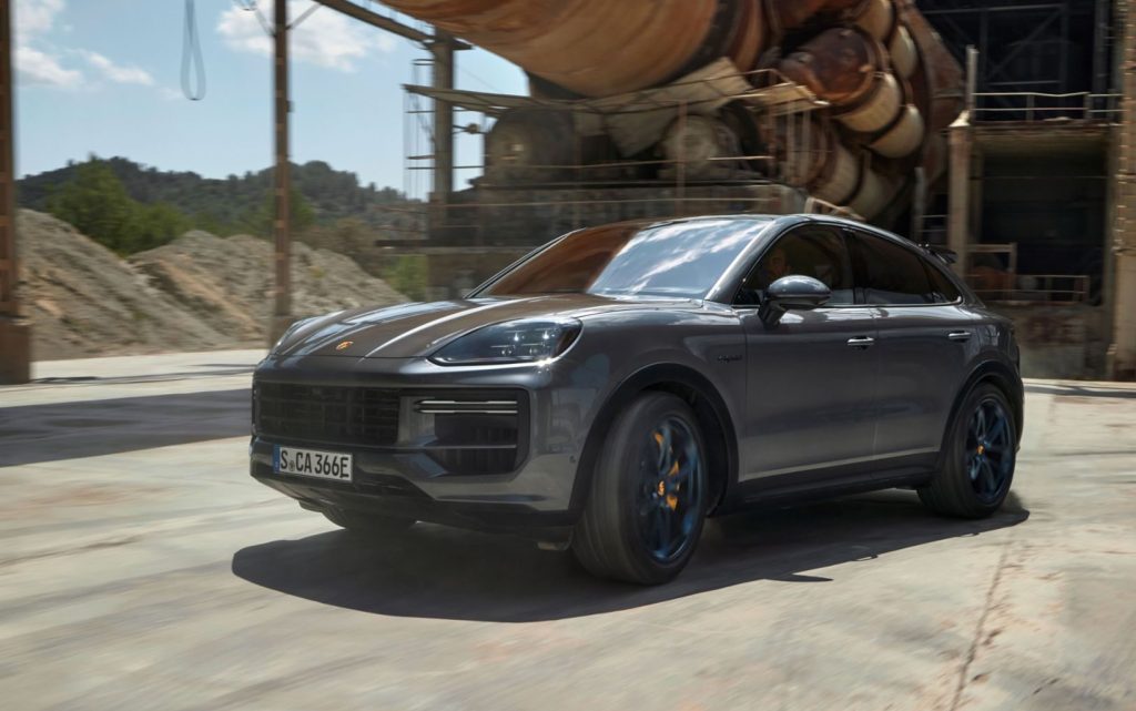Porsche Cayenne Turbo E-Hybrid Coupe driving under old pipe