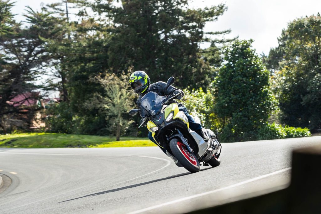 Aprilia SR GT200 scooter taking a corner at speed