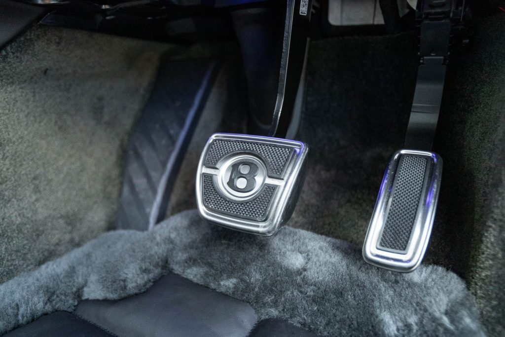 Bentley Bentayga EWB pedals, and lamb skin mat underneath