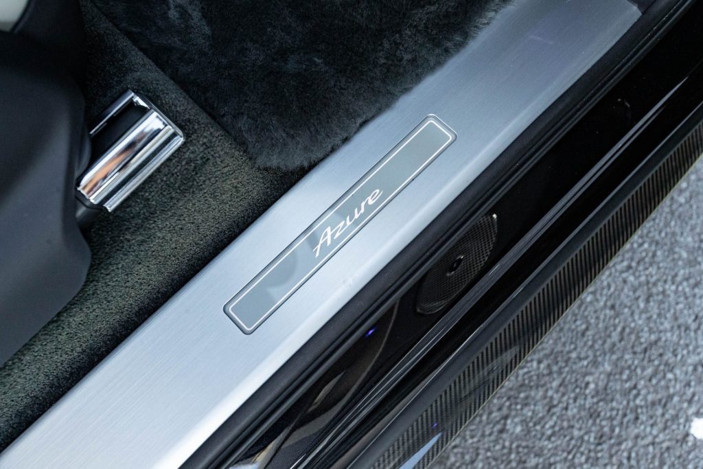 Azure Bentley badge on door sill, with lamb skin mat pictured