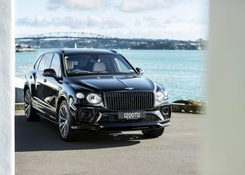 Front quarter of Bentley Bentayga EWB, with Auckland harbour bridge behind