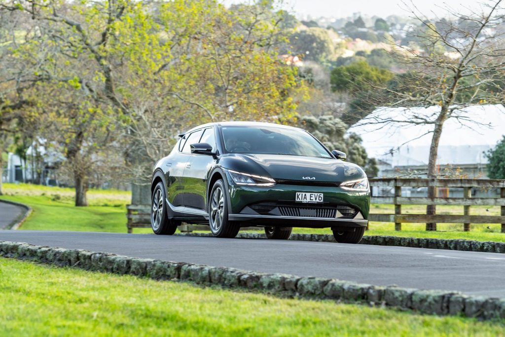 Kia EV6 driving past, front view