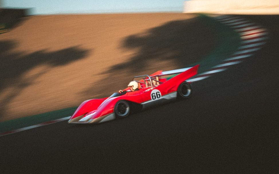 Lotus Type 66 driving down corkscrew at Laguna Seca