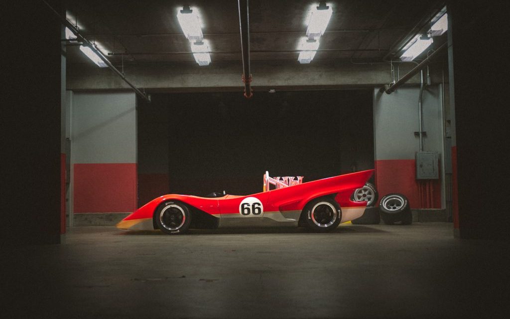 Lotus Type 66 parked in pit garage side profile