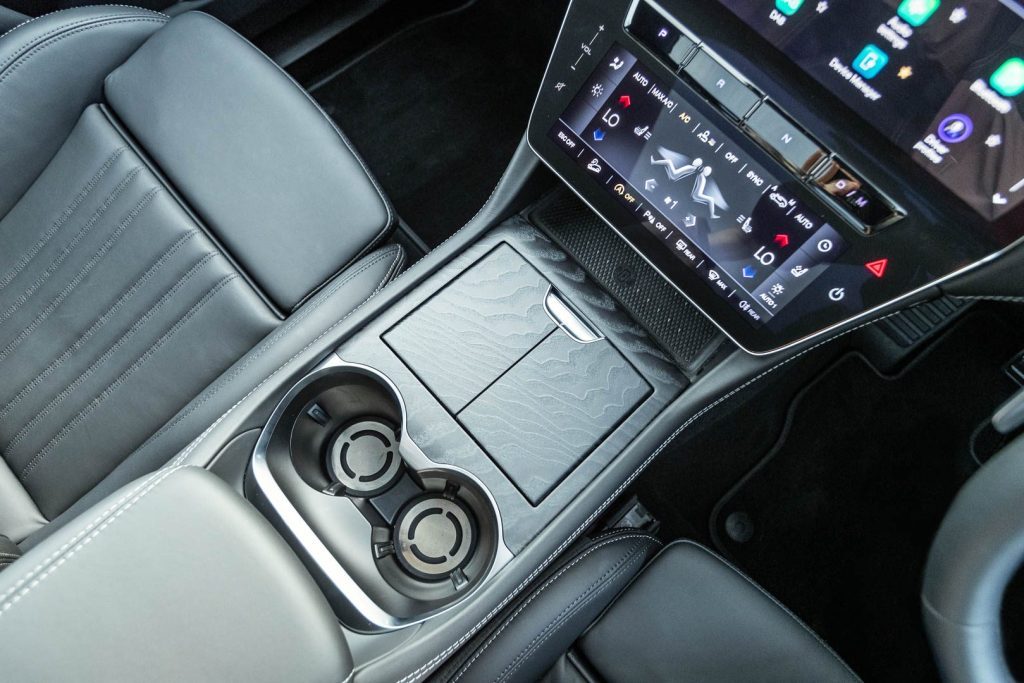 Centre console, cup holders, storage cupboard, and climate screen of the Maserati Grecale