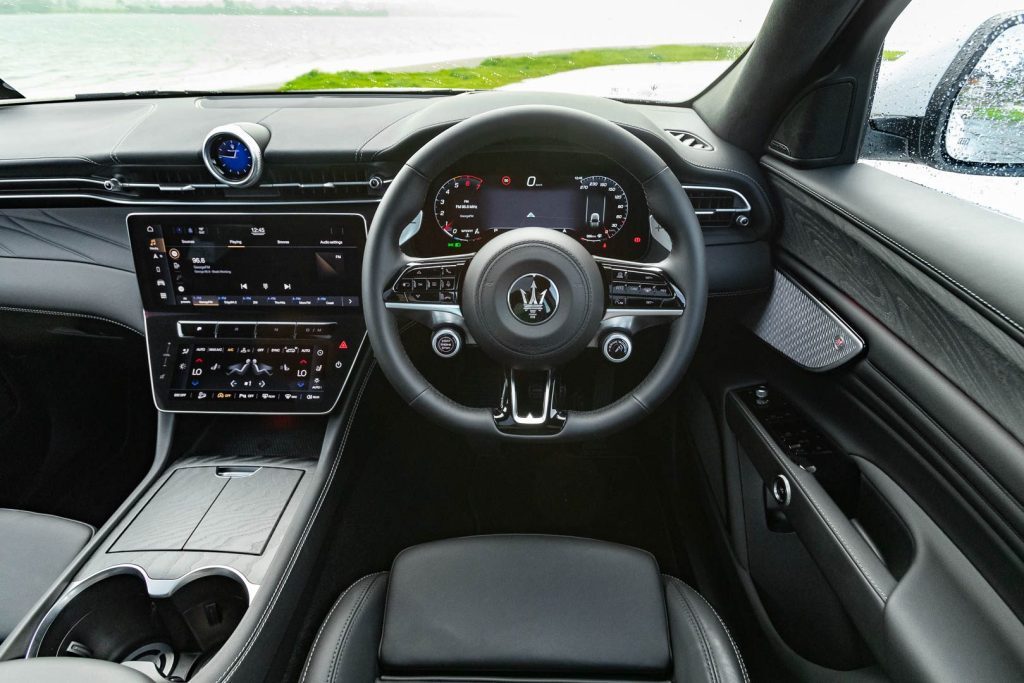 Steering wheel, dash, and door details of the Maserati Grecale Modena