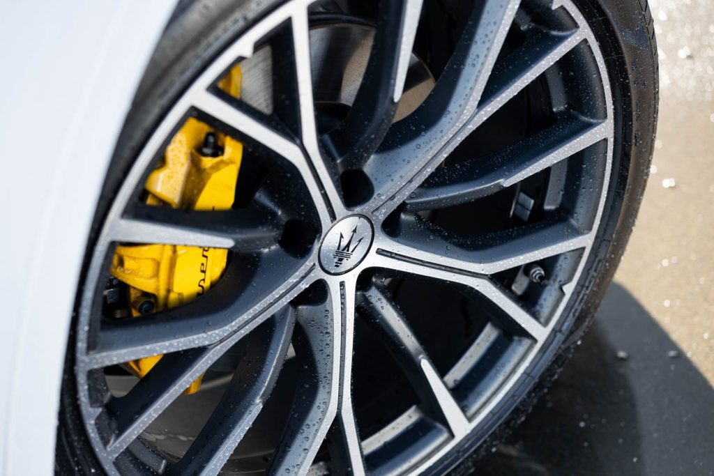 Wheel close up with yellow brake calipers on the Grecale