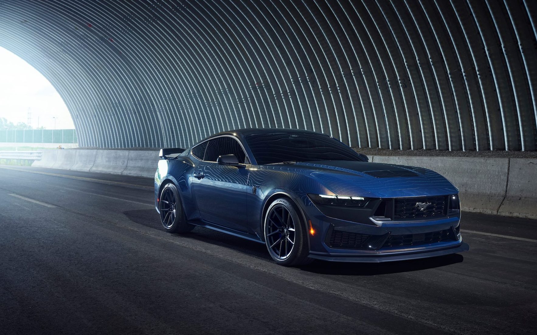 Ford Mustang Dark Horse driving through tunnel