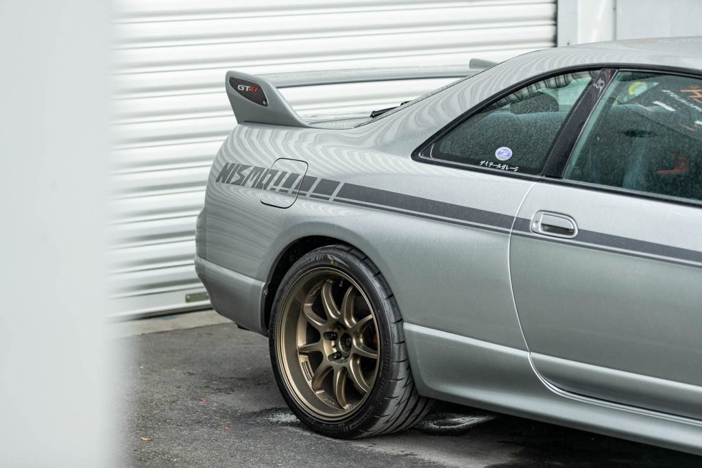 Rear quarter of R33 Nissan Skyline GTR, with Nismo decal