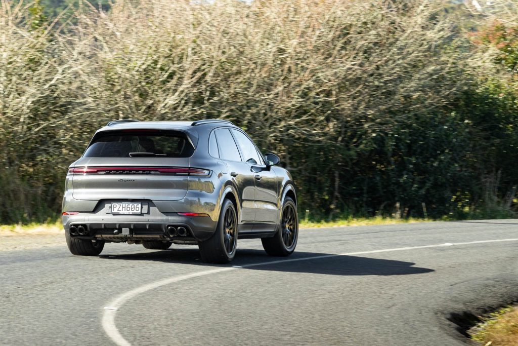 Silver Porsche Cayenne takes a corner