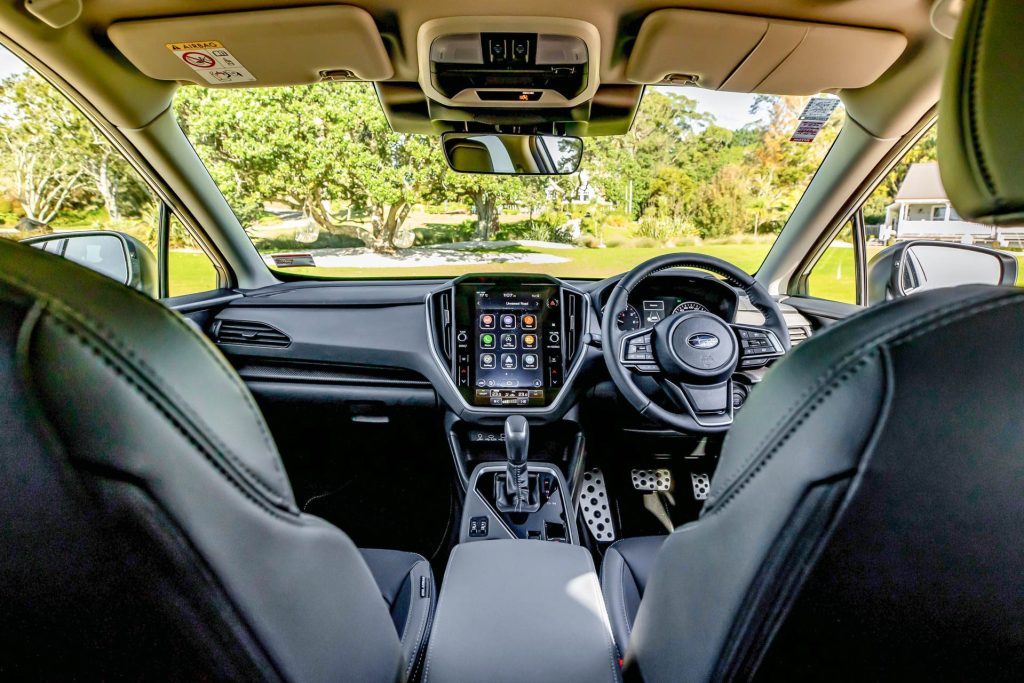 Front interior view of the Subaru Crosstrek, showing dash and steering wheel