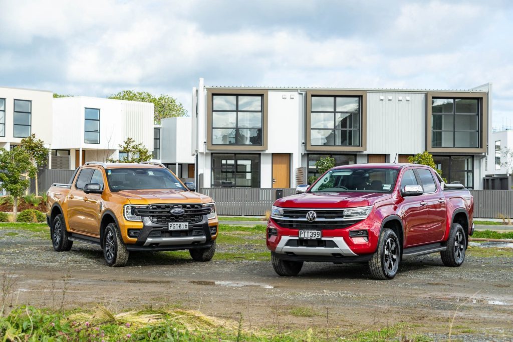 2023 VW Amarok in red parked next to Ford Ranger WIldtrak