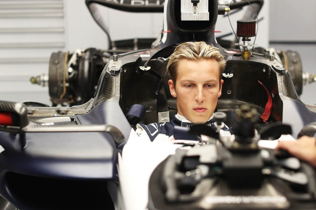 Liam Lawson sitting in AlphaTauri F1 car