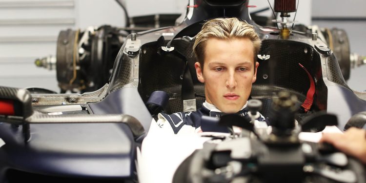 Liam Lawson sitting in AlphaTauri F1 car