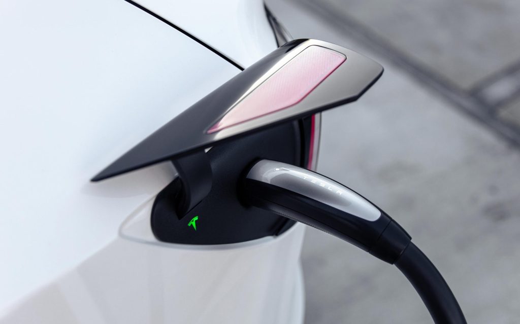 Tesla charger plugged into car
