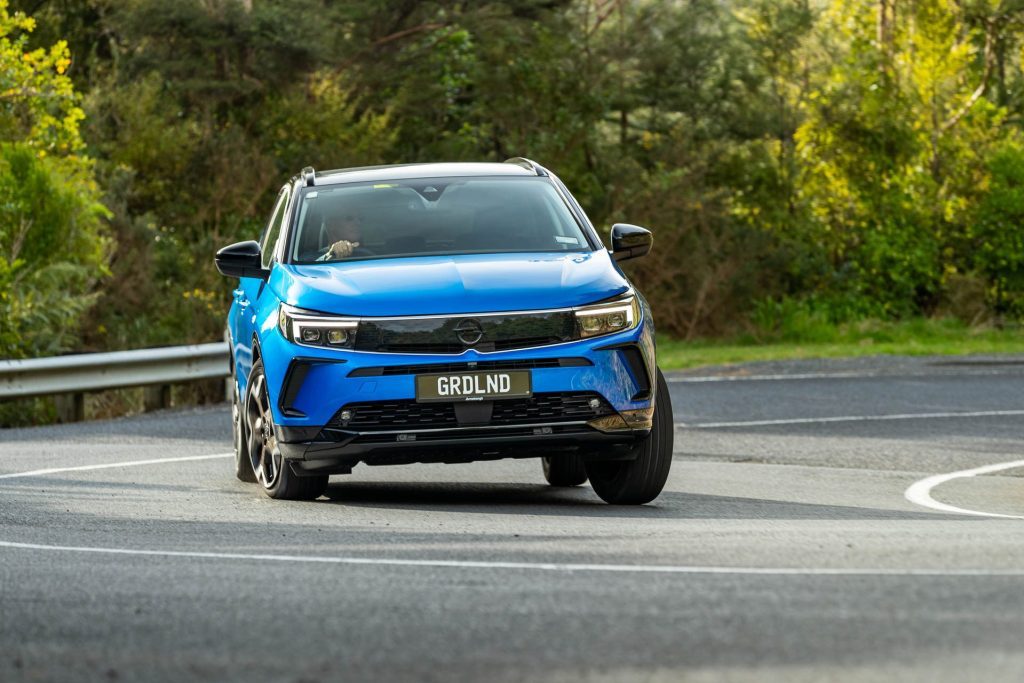 Blue Opel Grandland SRi, taking a tight corner