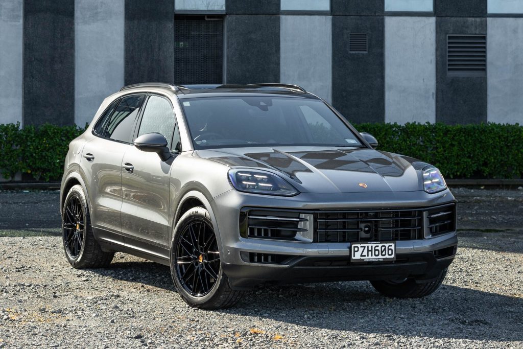 Porsche Cayenne front quarter shot, with wall behind