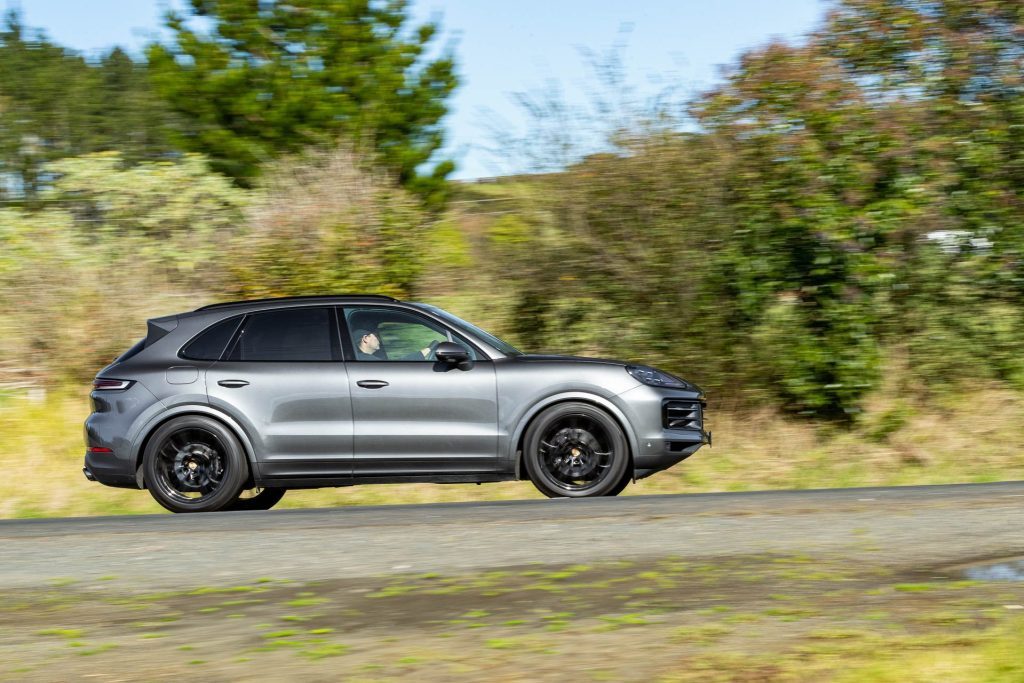 Side profile of Porsche Cayenne taking a corner