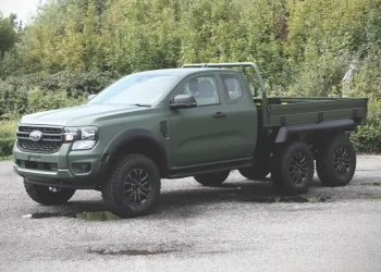 Ford Ranger HEX 6x6 by Ricardo, parked next to trees