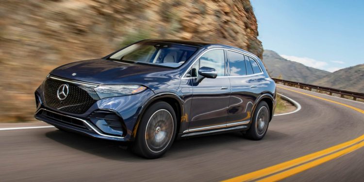 Mercedes-Benz EQS 450 4Matic SUV driving on mountain road