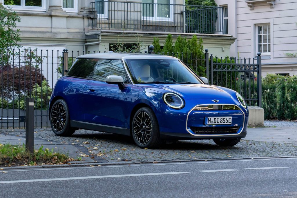 Mini Cooper Electric parked by trees