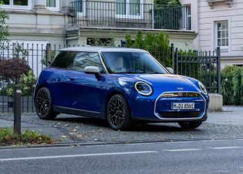 Mini Cooper Electric parked by trees