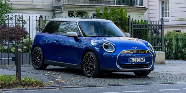 Mini Cooper Electric parked by trees