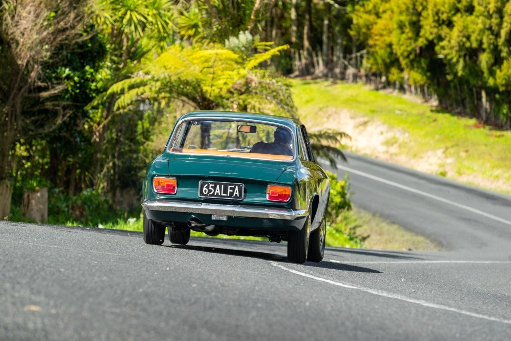 Taking a corner, seen from behind in the Alfa Romeo Giulia Sprint GT