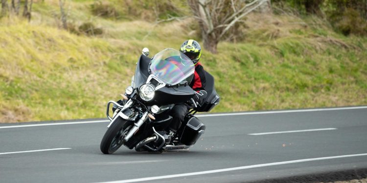 BMW R18 Transcontinental taking a corner, with sparks flying