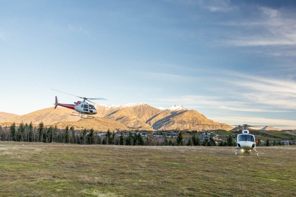 Helicopters taking off on a field