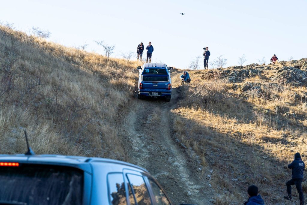 Ford Ranger climbing a large hill with people filming