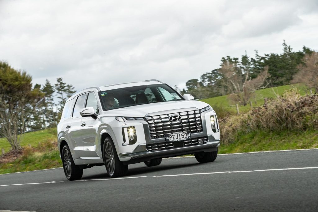 Hyundai Palisade, in white, action shot