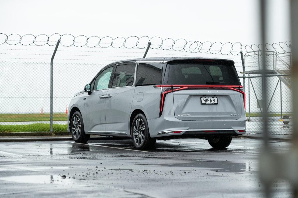 Rear view of the LDV MIFA 9 Premium, parked next to barbed wire