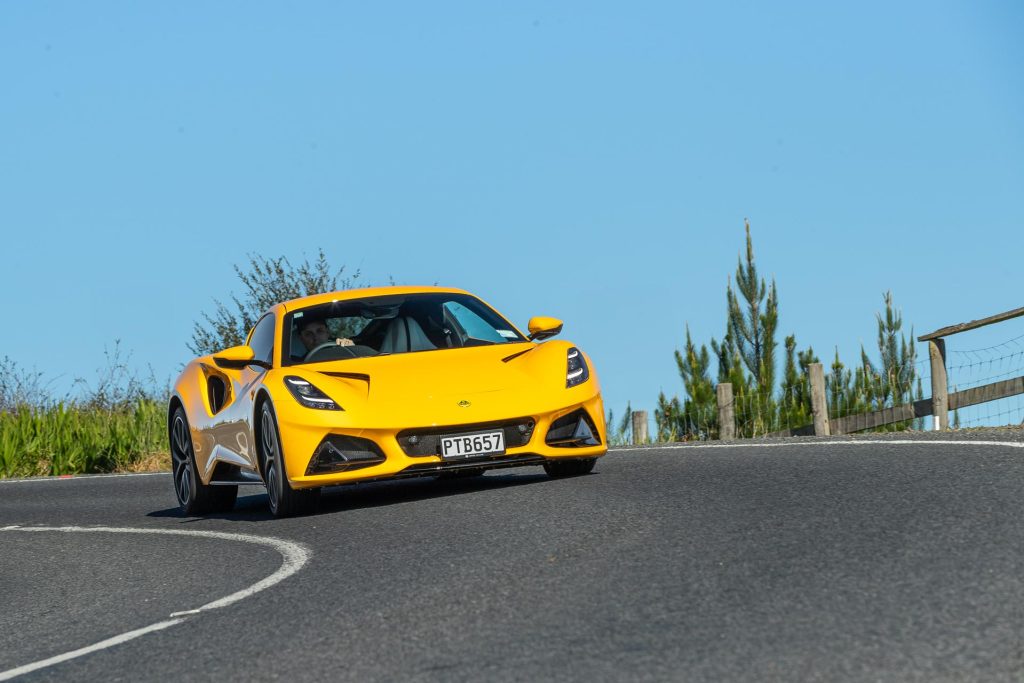 Lotus Emira V6 First Edition cornering on a sunny day