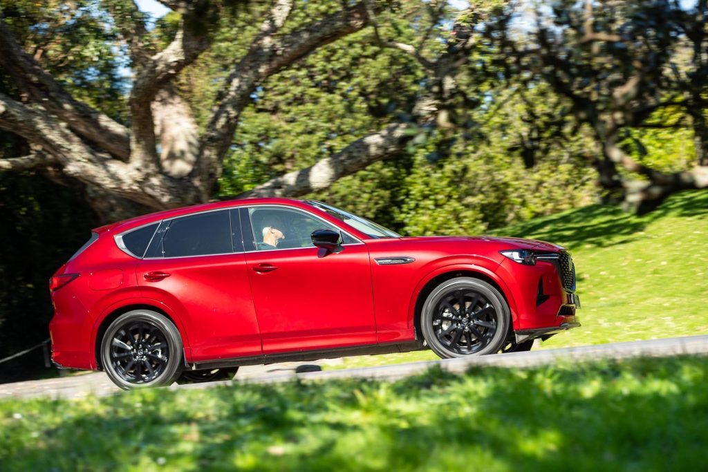 Mazda CX-60 Homura PHEV taking a bend, showing side of car