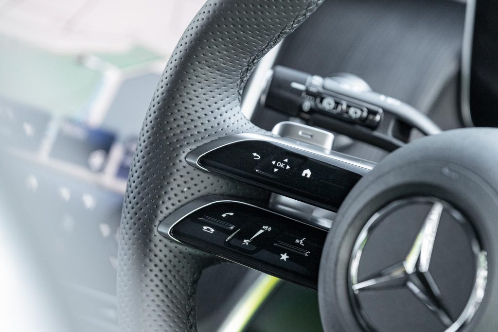 Steering wheel detail, showing haptic controls in the Mercedes-Benz GLC 300