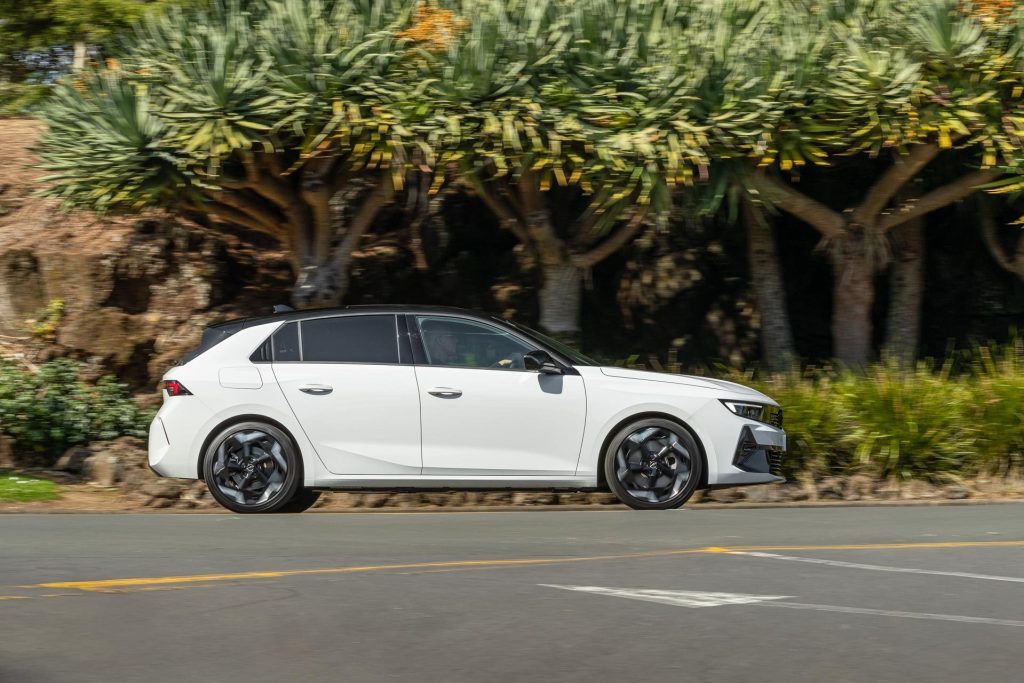 Opel Astra Hybrid in white, panning shot