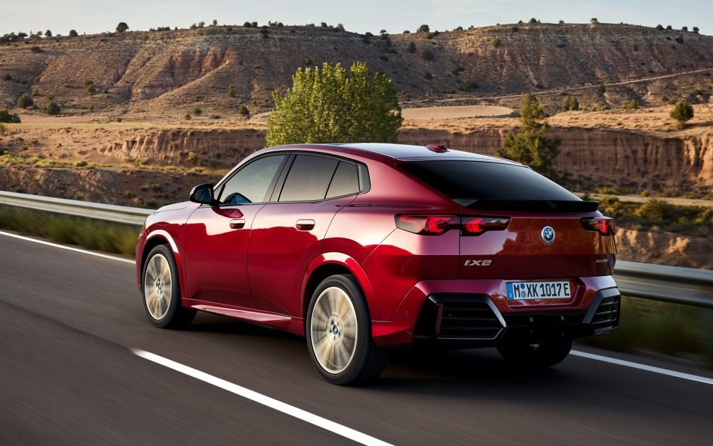 BMW iX2 driving on road