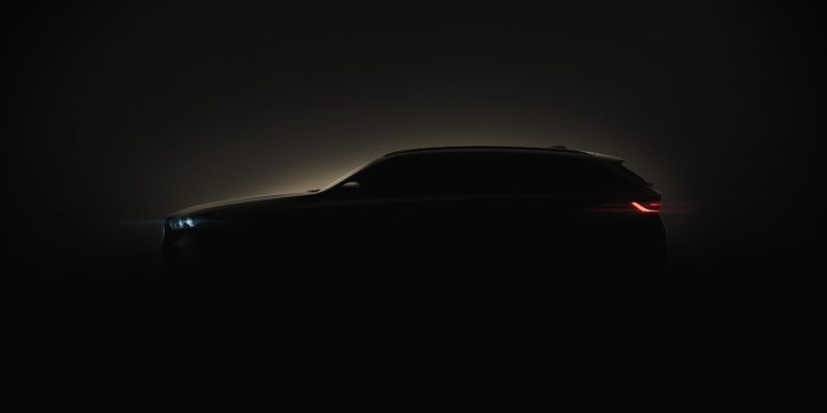 BMW 5 Series Touring silhouette with lights on